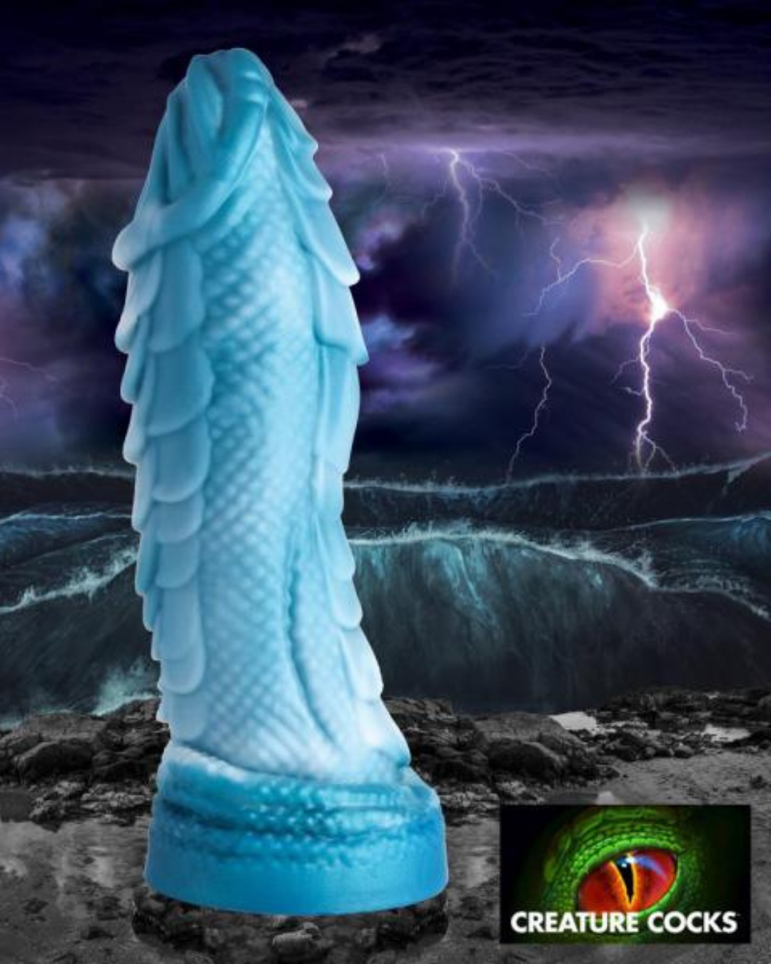 Sea Serpent Blue Scaly 8.5 Inch Silicone Dildo standing upright showing texture in front of a story sea landscape