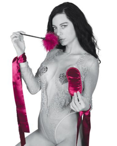 Sex & Mischief Enchanted Bondage Starter Kit - Red held by a female model