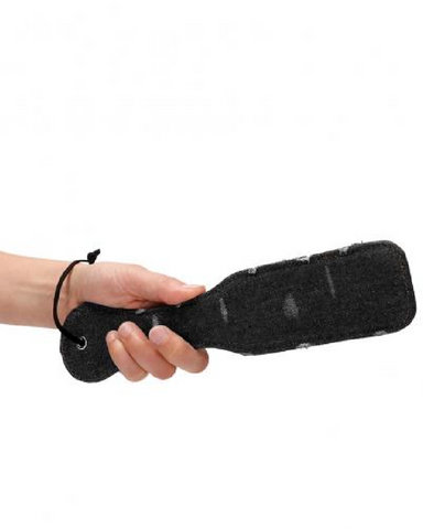 Model holding Ouch! Roughend Denim Style Paddle - Black
