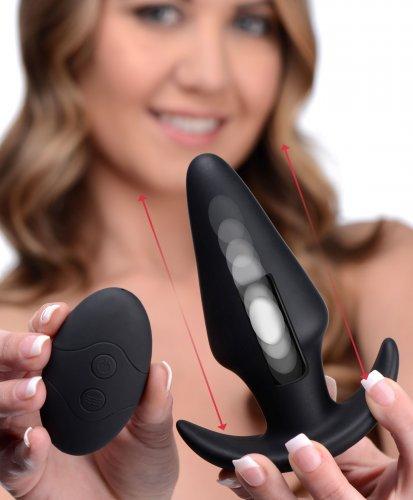 Woman holding the Kinetic Thumping 7X Large Remote Control Butt Plug - Black